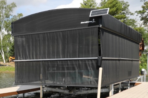ShoreScreen Power Curtain providing UV, debris, and insect protection for boats